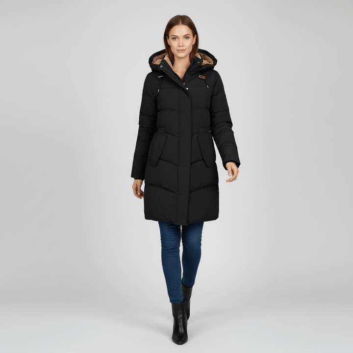 Elegant grön dam parkas med justerbar huva. En snygg och praktisk vinterjacka.