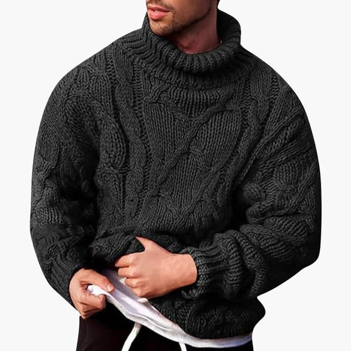 Kabelstickad herr pullover i grått, långärmad, för en tidlös och casual look under höst och vinter.