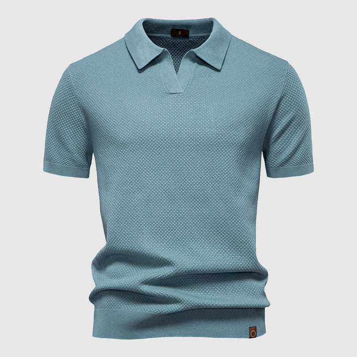 Herrpikétröja med polokrage i tidlös design, perfekt för sommar och vår.