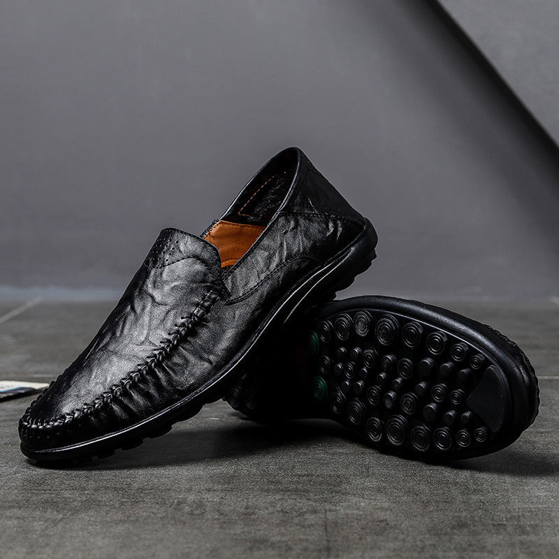 Formella herrloafers i svart läder, en elegant och bekväm sko för män.