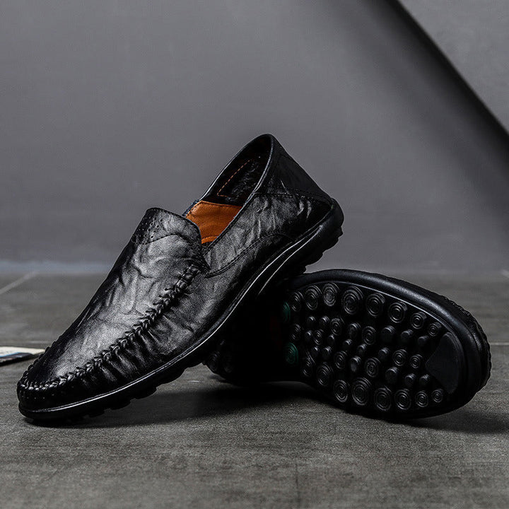 Formella herrloafers i svart läder, en elegant och bekväm sko för män.