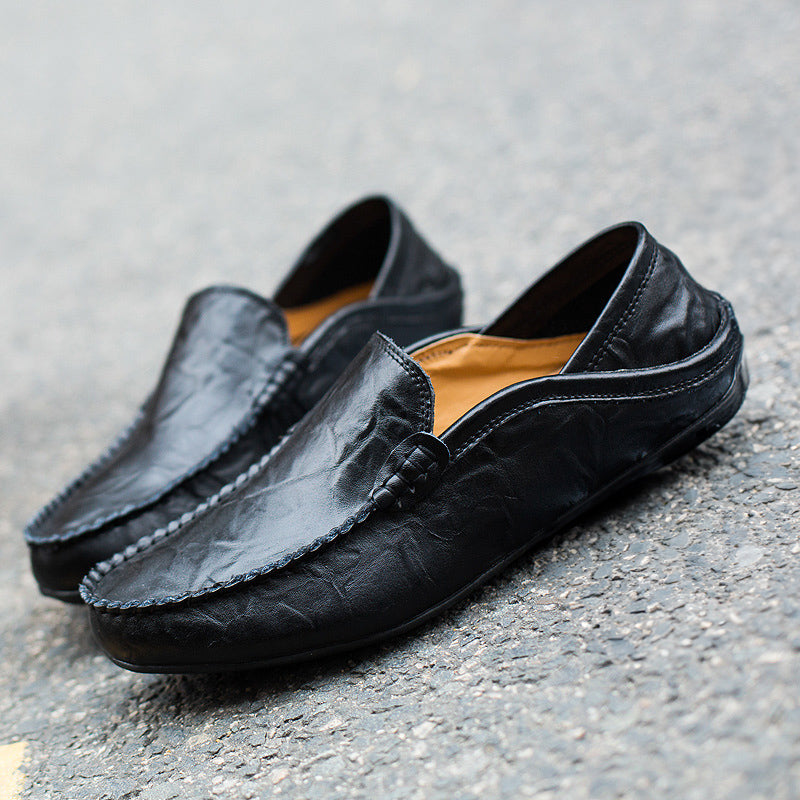 Herrloafers i kognac brunt läder, sidovy som visar klassisk silhuett