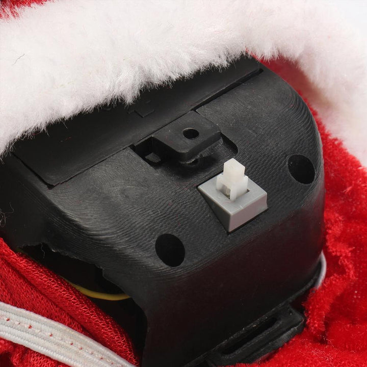 "Klättrande jultomte i röd dräkt, automatisk med musik. Perfekt juldekoration för inomhus och utomhus."