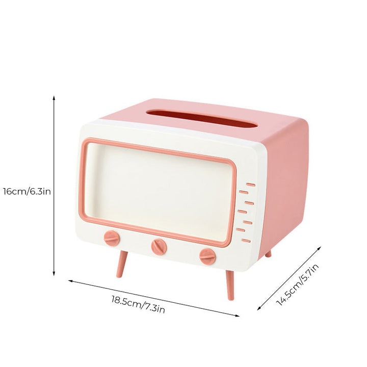 "Kreativ retro TV-servettlåda med mobilhållare i pastellfärger, nostalgi design för smart och stilren inredning."