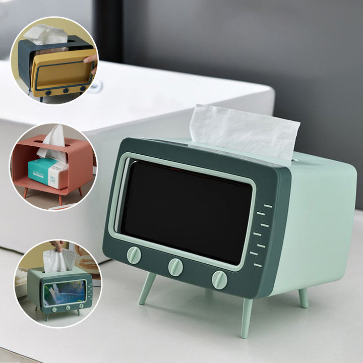 "Kreativ retro TV-servettlåda med mobilhållare i pastellfärger, nostalgi design för smart och stilren inredning."
