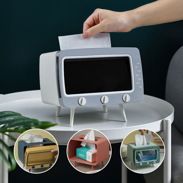 "Kreativ retro TV-servettlåda med mobilhållare i pastellfärger, nostalgi design för smart och stilren inredning."