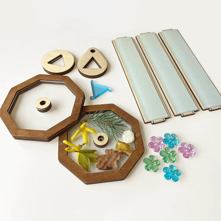 Kreativt kalejdoskop kit för barn i trä, med magnetlock, visar färgglada mönster och stimulerar kreativitet.