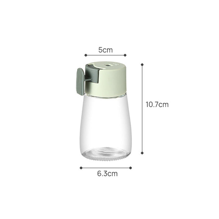 "Kvantitativ kryddflaska med tryckfunktion, elegant glasdesign, exakt dosering, köksprodukt, 180 ml kapacitet."