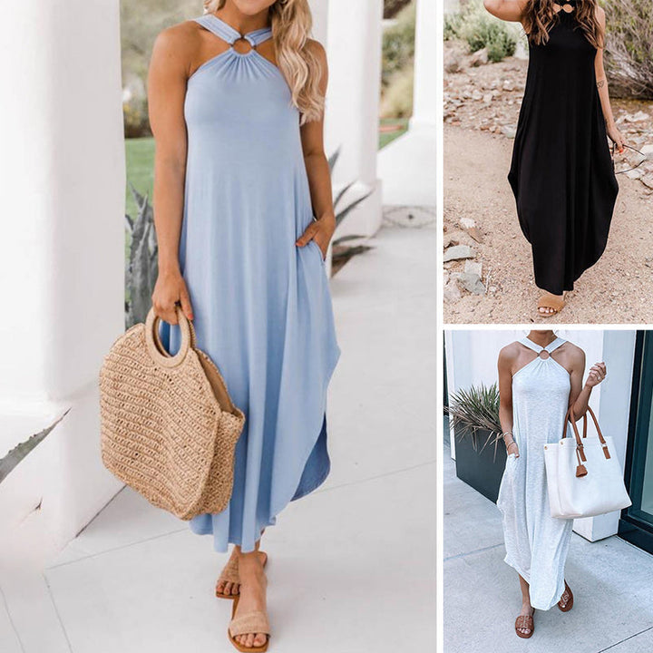 "Kvinna i elegant halterneck sommarklänning med utsvängd fåll, betonar feminin stil och smickrande siluett."