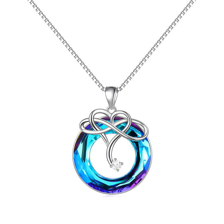"Kvinna oändlighet halsband & örhängen set i silver och blått, elegant smyckesdesign för modern stil och tidlös charm."