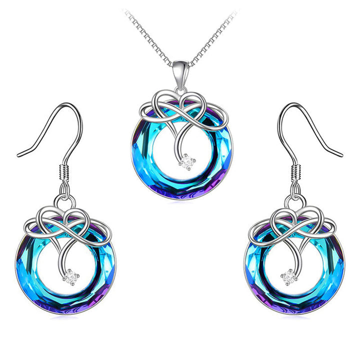 "Kvinna oändlighet halsband & örhängen set i silver och blått, elegant smyckesdesign för modern stil och tidlös charm."