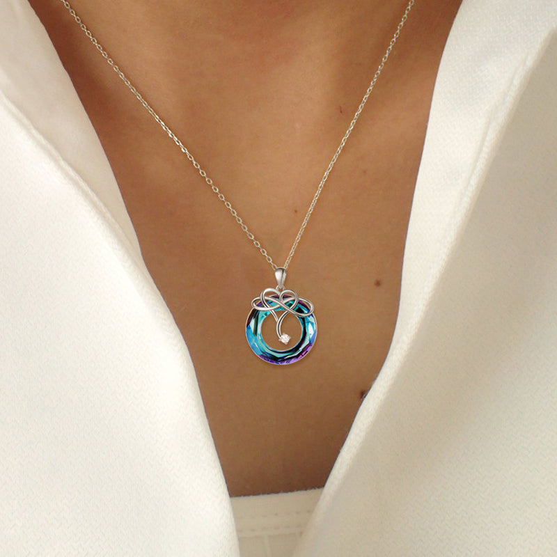 "Kvinna oändlighet halsband & örhängen set i silver och blått, elegant smyckesdesign för modern stil och tidlös charm."