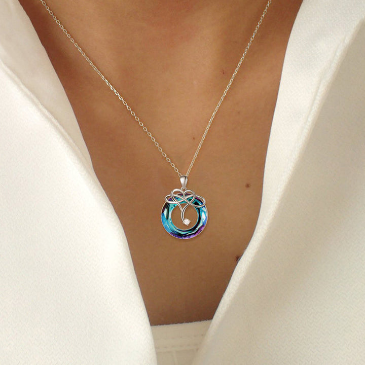 "Kvinna oändlighet halsband & örhängen set i silver och blått, elegant smyckesdesign för modern stil och tidlös charm."