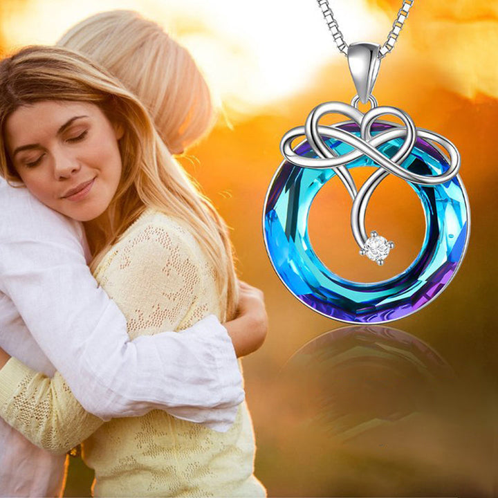 "Kvinna oändlighet halsband & örhängen set i silver och blått, elegant smyckesdesign för modern stil och tidlös charm."