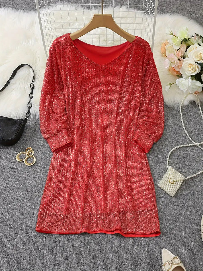 Snygg off-shoulder paljettklänning som framhäver siluetten, en glamorös festklänning för kvinnor.
