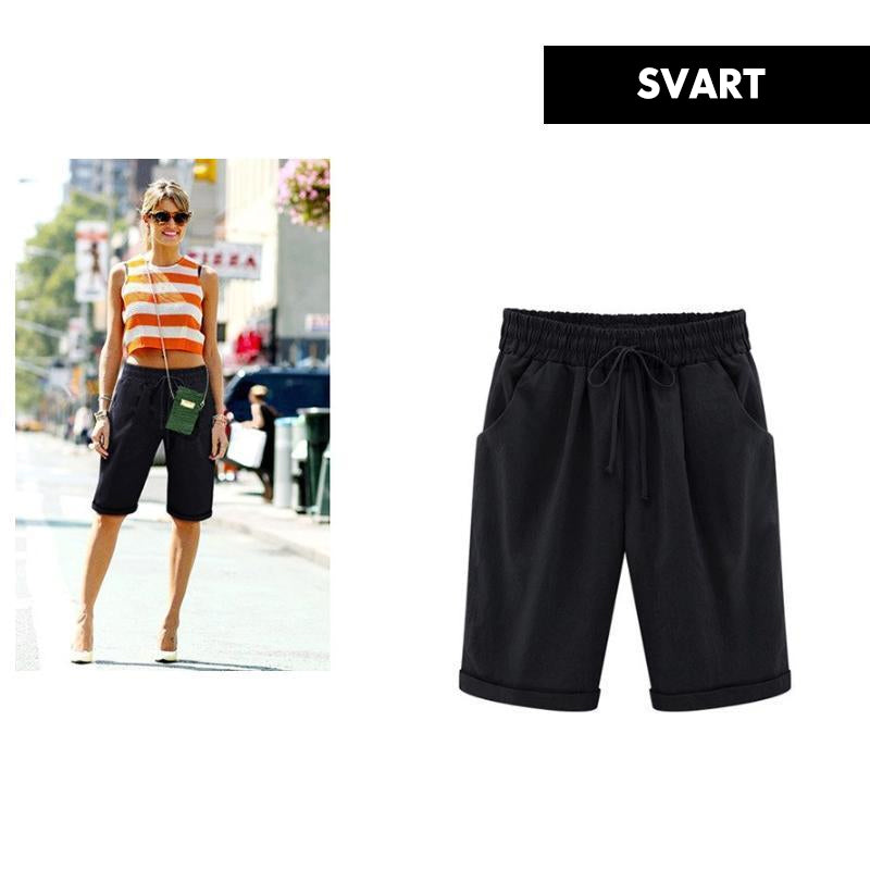"Kvinnors avslappnade sommarshorts i polyester, löst sittande, olika färger, perfekt för vår och sommar."
