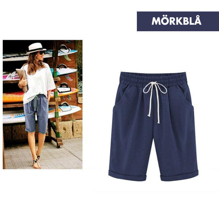 "Kvinnors avslappnade sommarshorts i polyester, löst sittande, olika färger, perfekt för vår och sommar."