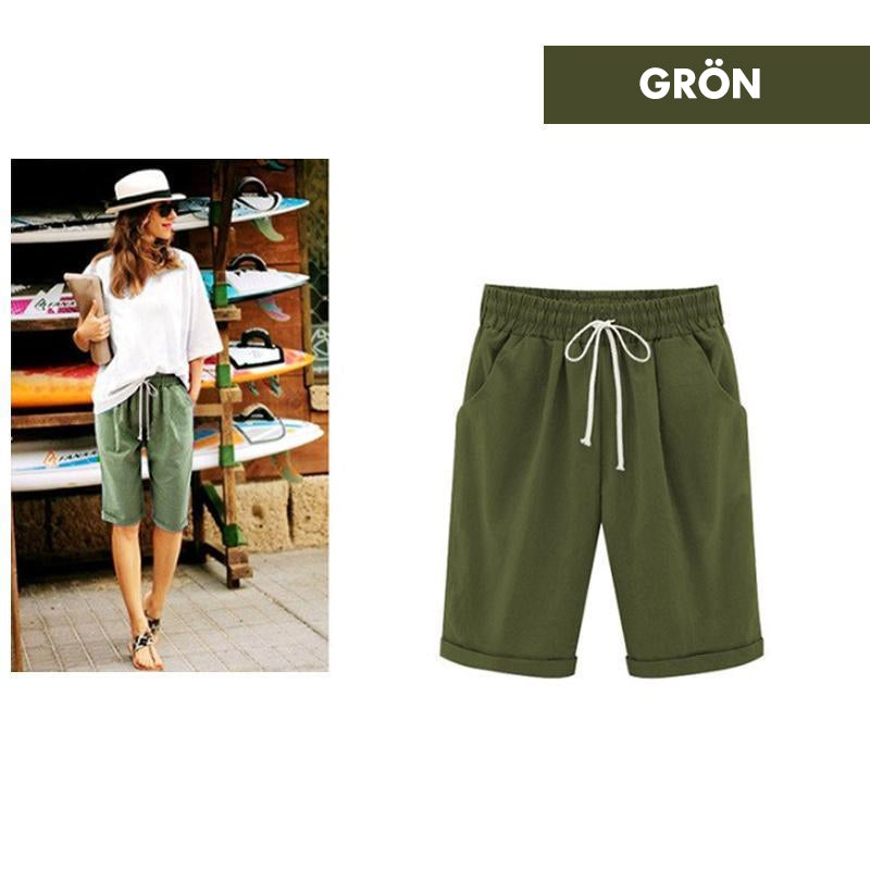"Kvinnors avslappnade sommarshorts i polyester, löst sittande, olika färger, perfekt för vår och sommar."