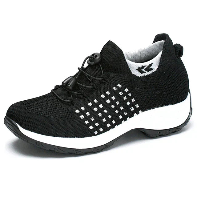 Stilrena och bekväma sneakers för kvinnor, svarta med vit sula, för daglig användning och stöd.