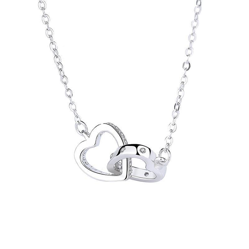 "Kvinnors halsband med rosguld/silver hjärthänge, zirconia-stenar, justerbar kedja; evig kärlek symboliserad."