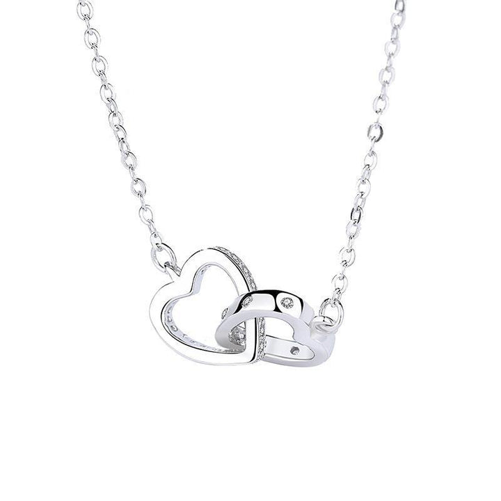 "Kvinnors halsband med rosguld/silver hjärthänge, zirconia-stenar, justerbar kedja; evig kärlek symboliserad."