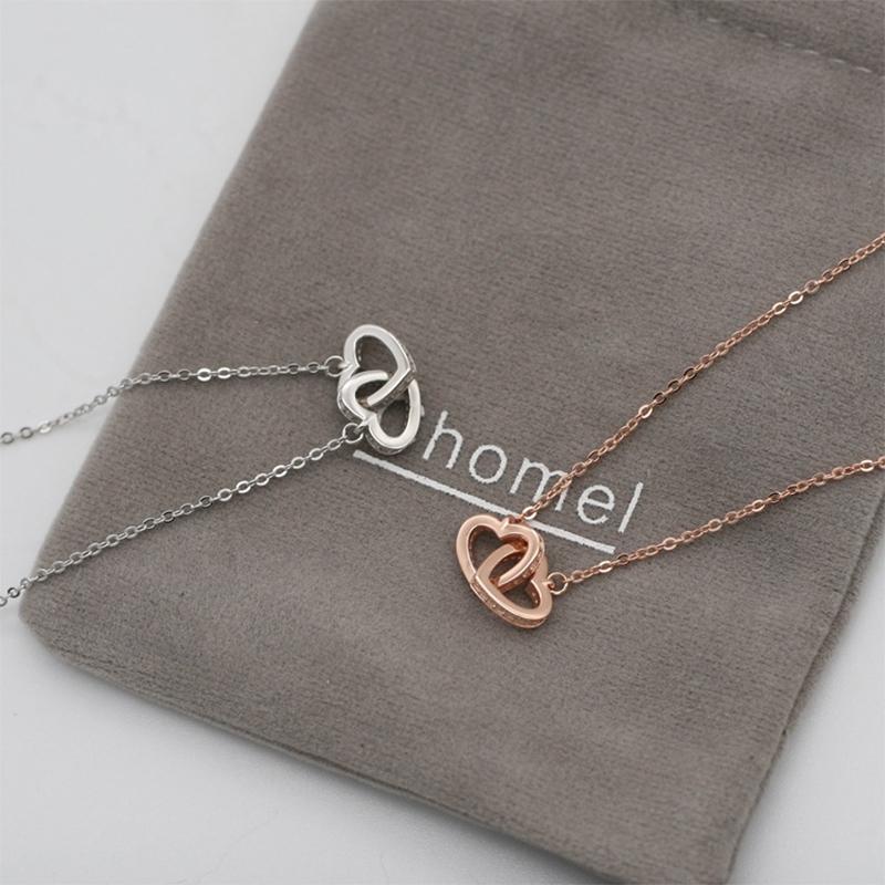 "Kvinnors halsband med rosguld/silver hjärthänge, zirconia-stenar, justerbar kedja; evig kärlek symboliserad."