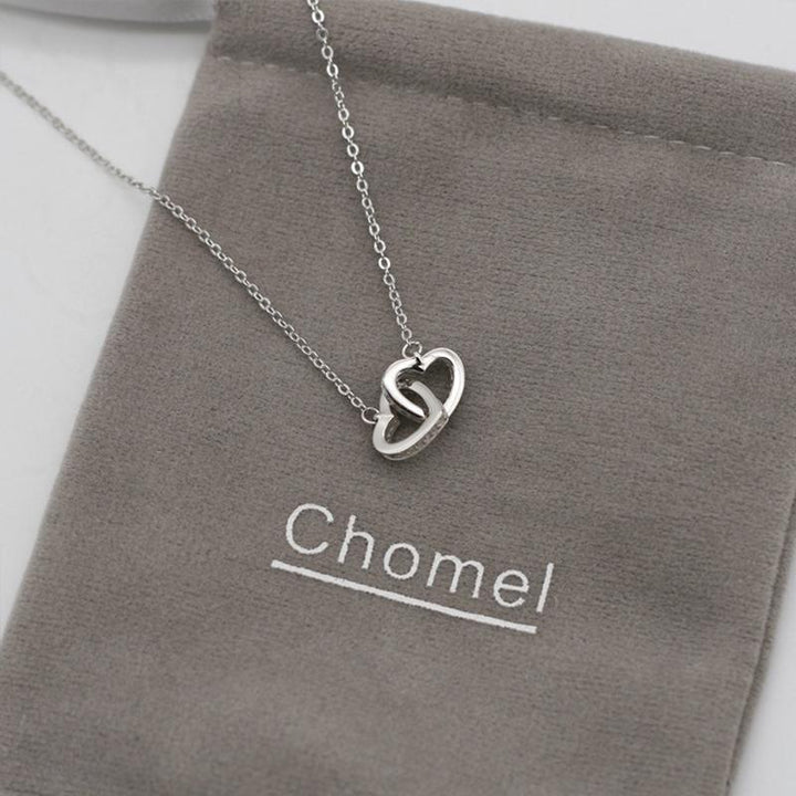 "Kvinnors halsband med rosguld/silver hjärthänge, zirconia-stenar, justerbar kedja; evig kärlek symboliserad."