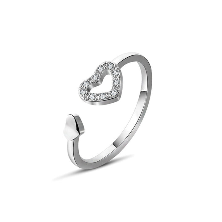 Kvinnors justerbar sterling silverring med glansig zirconia, elegant och symbolisk design, perfekt för alla tillfällen.