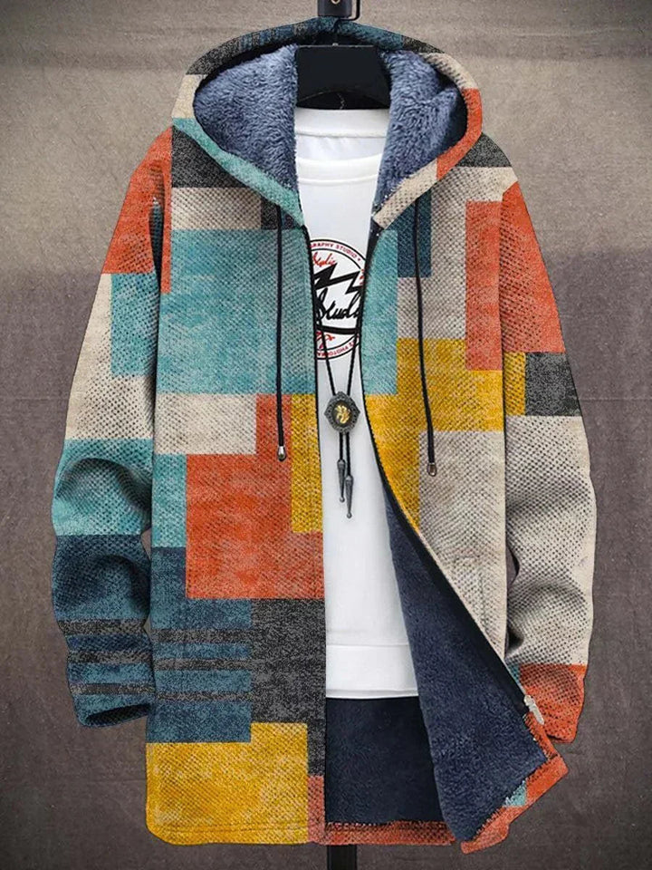 Detaljbild av en kvinnors cardigan, visar unika mönster och flerfärgad design.