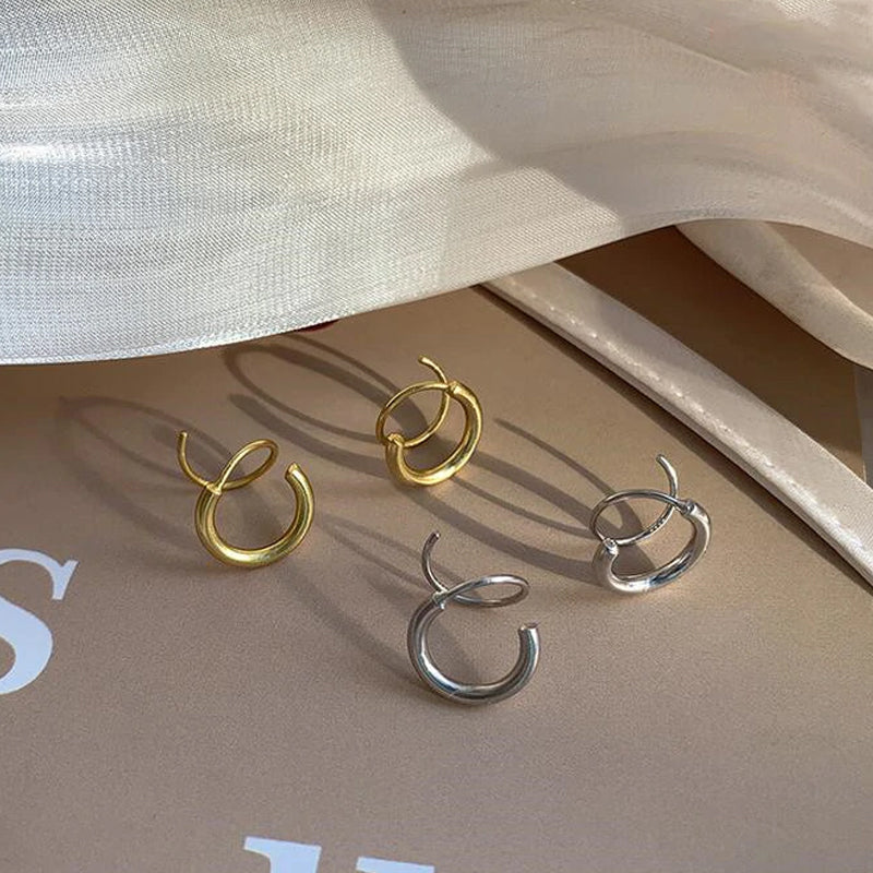 "Kvinnors kopparörhängen i spiralform med 14k guldplätering, elegant design för alla tillfällen."