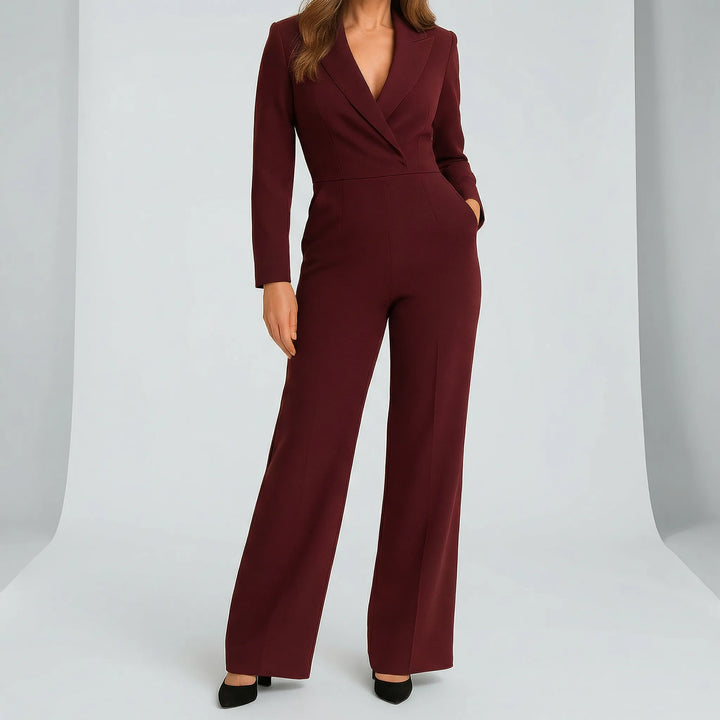 Figursydd jumpsuit för dam i svart, med långa ärmar, djup v-ringning och trendiga vida ben. Modern stil.