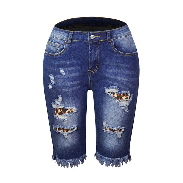 "Kvinnors ljusblå stretchiga jeans med leopardmönster, stilrena och bekväma för alla tillfällen."