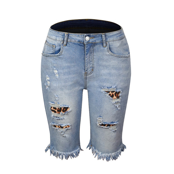 "Kvinnors ljusblå stretchiga jeans med leopardmönster, stilrena och bekväma för alla tillfällen."
