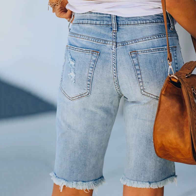 "Kvinnors ljusblå stretchiga jeans med leopardmönster, stilrena och bekväma för alla tillfällen."