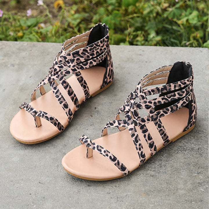 "Kvinnors platta sandaler med dragkedja, korsband och PU-material för sommar. Perfekt för en stilfull och bekväm look."