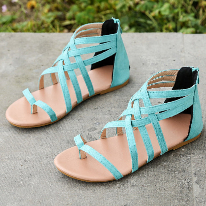"Kvinnors platta sandaler med dragkedja, korsband och PU-material för sommar. Perfekt för en stilfull och bekväm look."