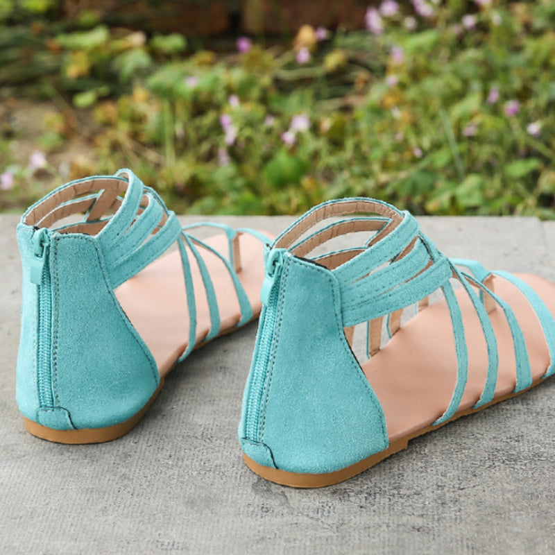 "Kvinnors platta sandaler med dragkedja, korsband och PU-material för sommar. Perfekt för en stilfull och bekväm look."