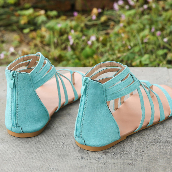 "Kvinnors platta sandaler med dragkedja, korsband och PU-material för sommar. Perfekt för en stilfull och bekväm look."