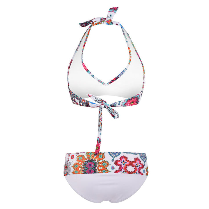 "Kvinnors sommarblommig bikiniset framifrån, livlig blommig design i blå och vit för strand och pooldagar."