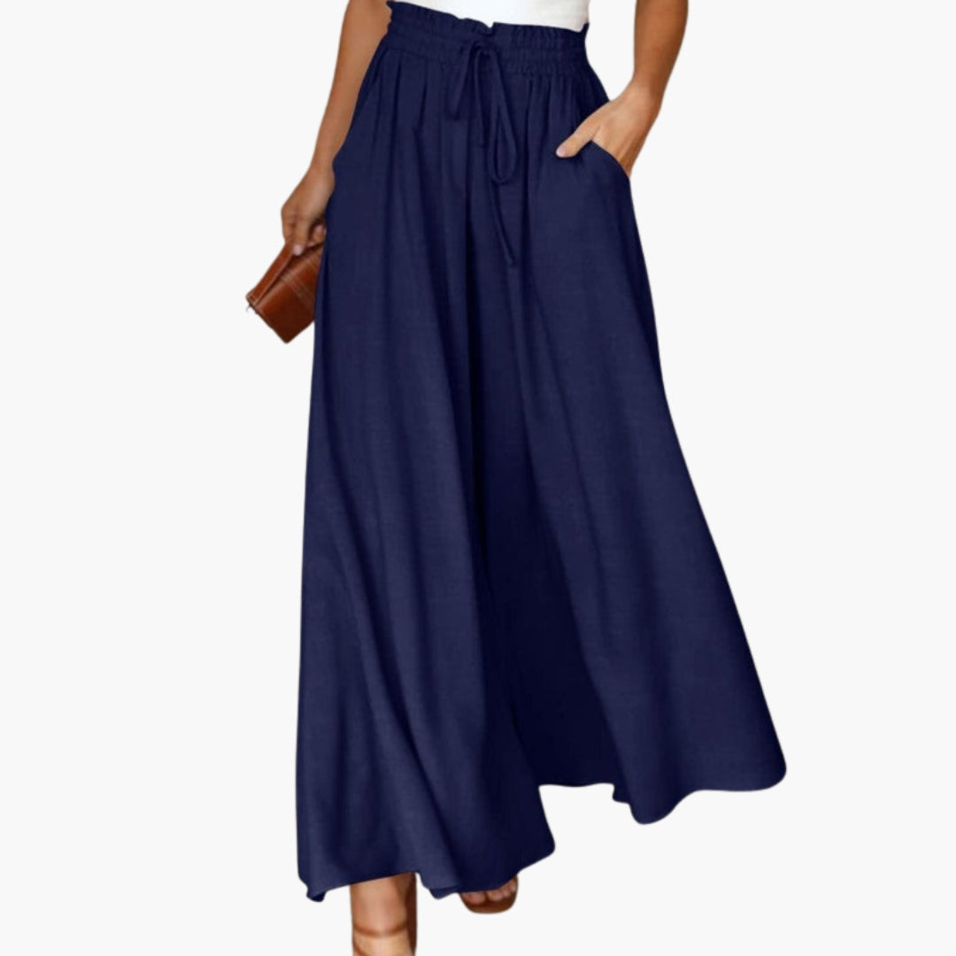 Stilrena vida byxor med dragsko i midjan, perfekta för en chic sommarlook.