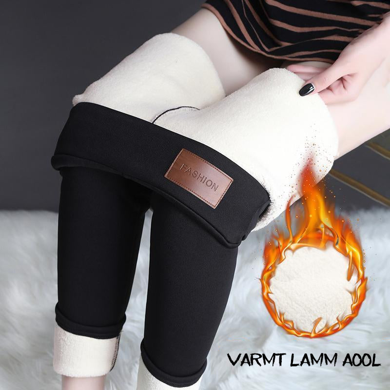 "Kvinnors vintertäta fleecefodrade leggings i grått eller svart, med elastisk passform och mjukt foder för optimal värme."