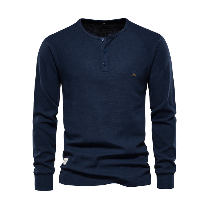 Elegant långärmad herrskjorta i bomull med distinkt våffelstruktur, perfekt för höstmode.