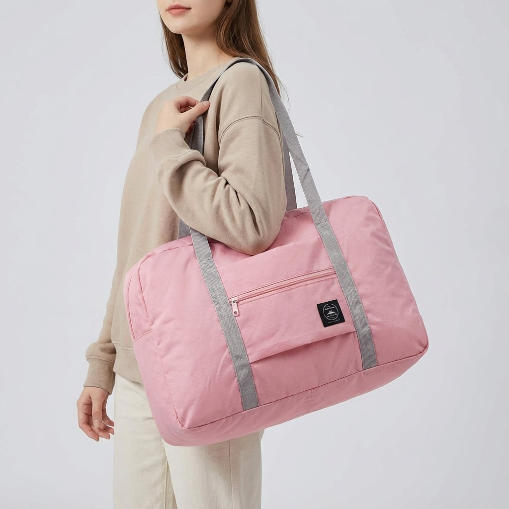 Stilren blå unisex weekendväska, hopfällbar och lättviktig. Vattentät duffelbag perfekt för flygresa.