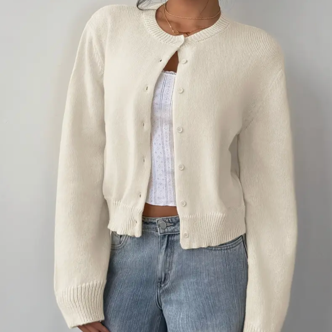 Elegant flerfärgad damkofta, ribbad med korta knappar för en avslappnad look.