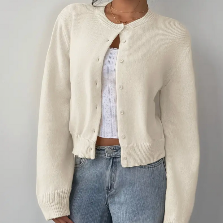 Elegant flerfärgad damkofta, ribbad med korta knappar för en avslappnad look.