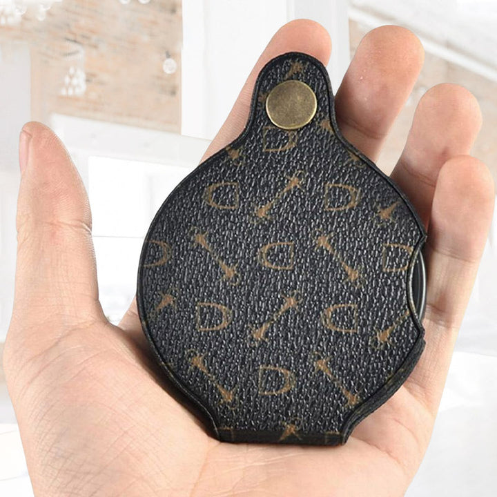 "Läderfodral med förstoringsglas, 15x förstoring, kompakt PU läder, elegant design, för resor och dagligt bruk."