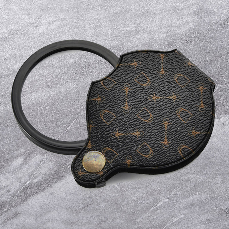 "Läderfodral med förstoringsglas, 15x förstoring, kompakt PU läder, elegant design, för resor och dagligt bruk."