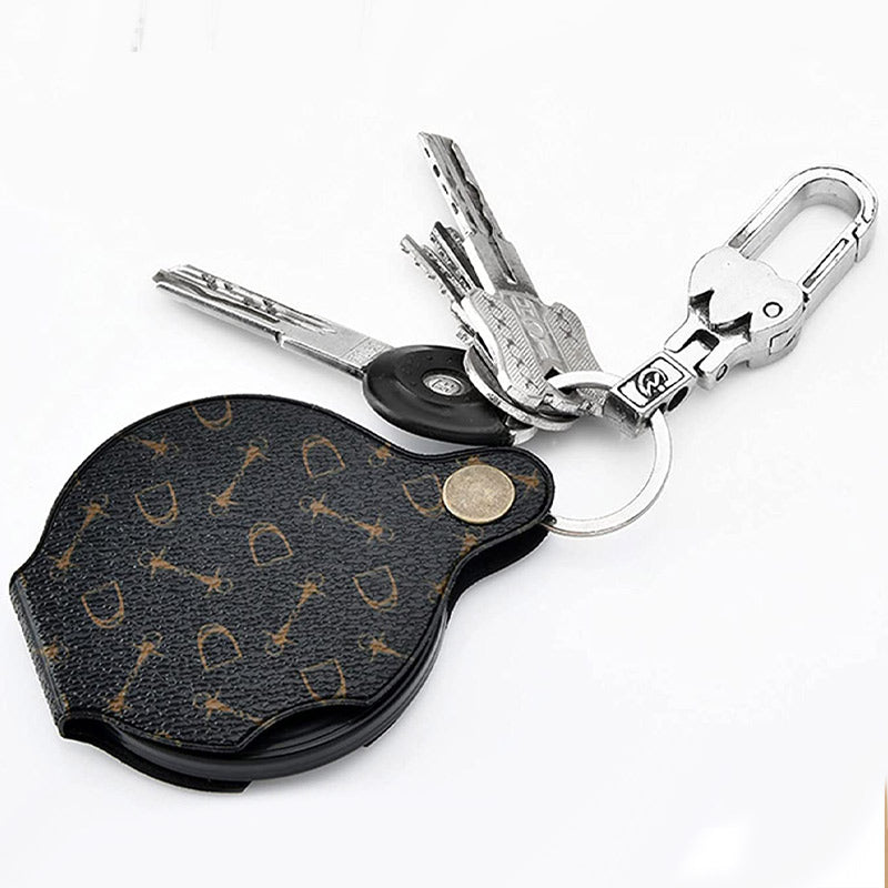 "Läderfodral med förstoringsglas, 15x förstoring, kompakt PU läder, elegant design, för resor och dagligt bruk."