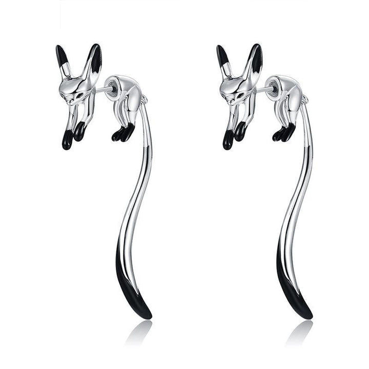 "Långa eleganta rävörhängen för kvinnor i roseguld, guld och silver. Smycke med unik design, symboliserar intelligens."