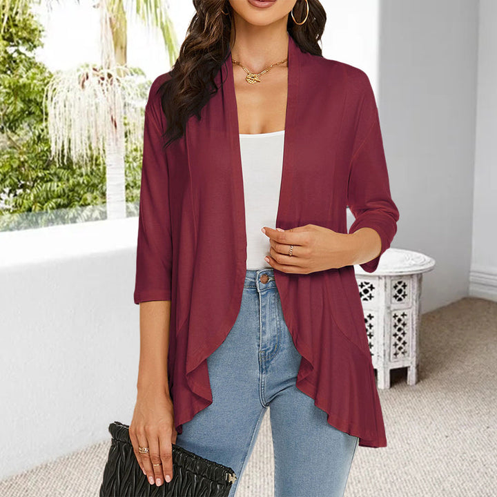 Lättvikts vår-sommar cardigan med 3/4 ärmar, öppen design och oregelbunden fåll, perfekt för modernt kvinno-mode.